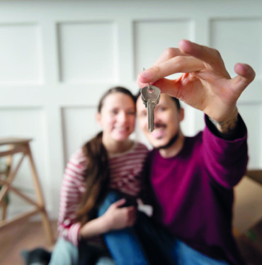 young-couple-moving-into-new-home_23-2149199065